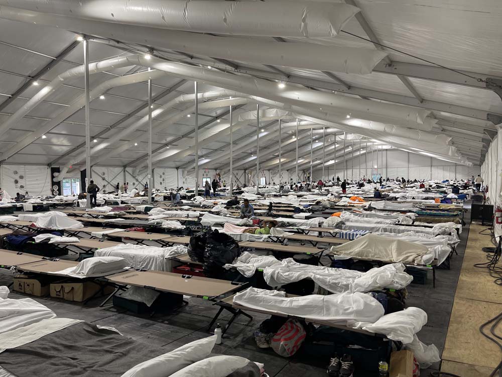 Emergency response temporary structure with cots for shelter support